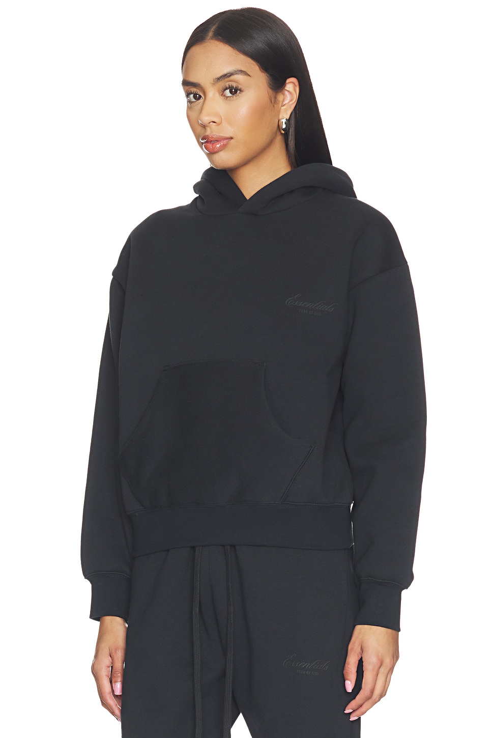 Fear of God ESSENTIALS Classic Hoodie in Vintage Black | REVOLVE