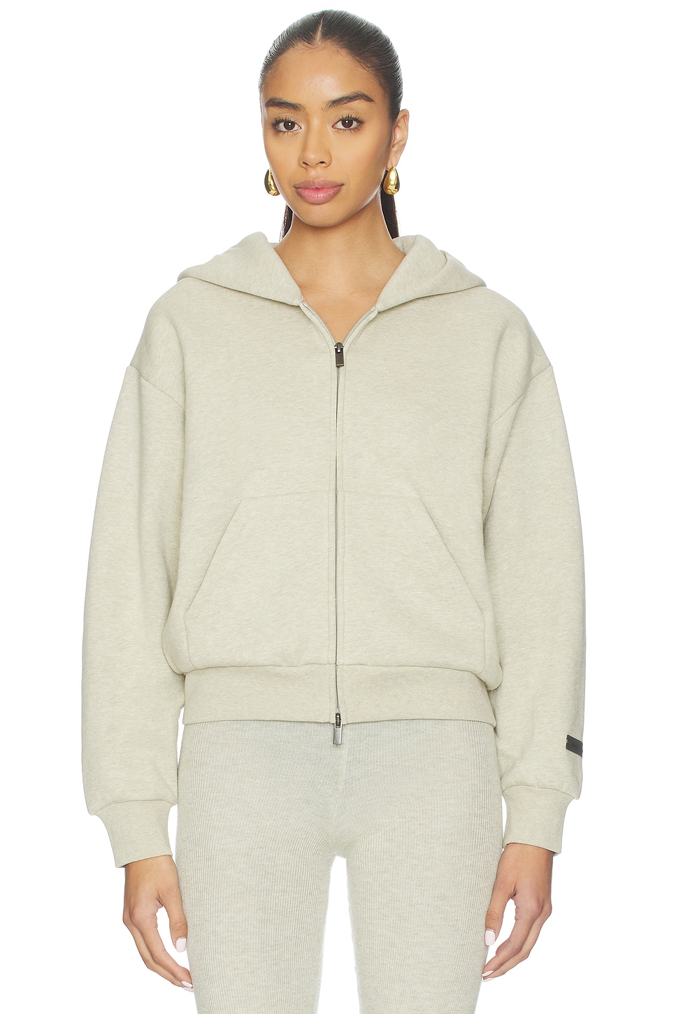 Fear of God ESSENTIALS Fleece Classic Fit Zip-up Hoodie in Heather Stone | REVOLVE