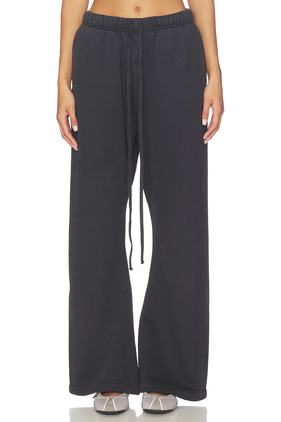 Fear of God ESSENTIALS Flare Sweatpant in Vintage Black | REVOLVE
