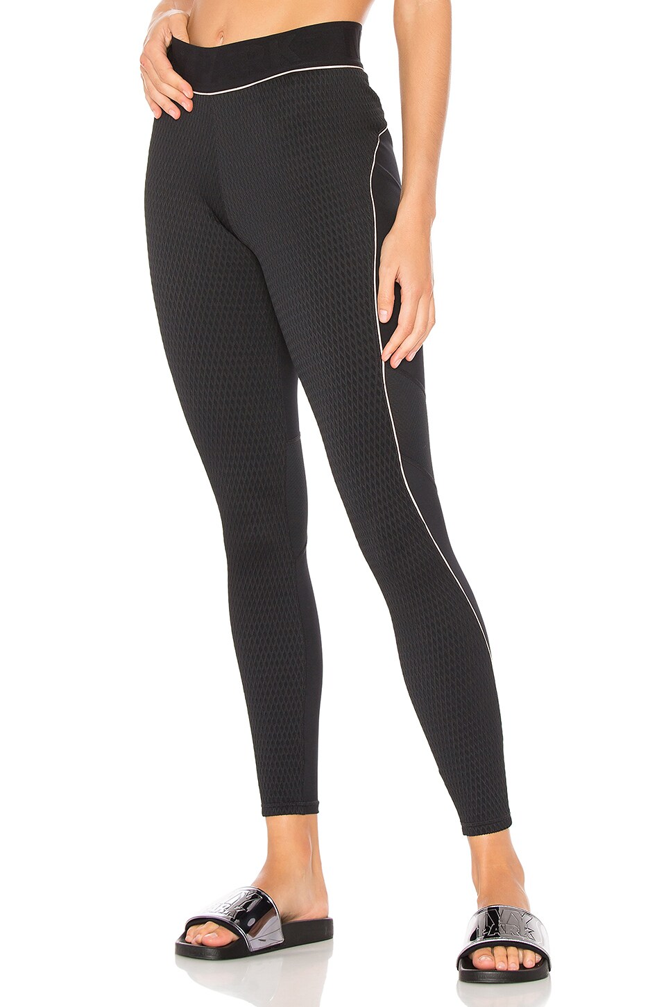 nike archive leggings in black with piped trim