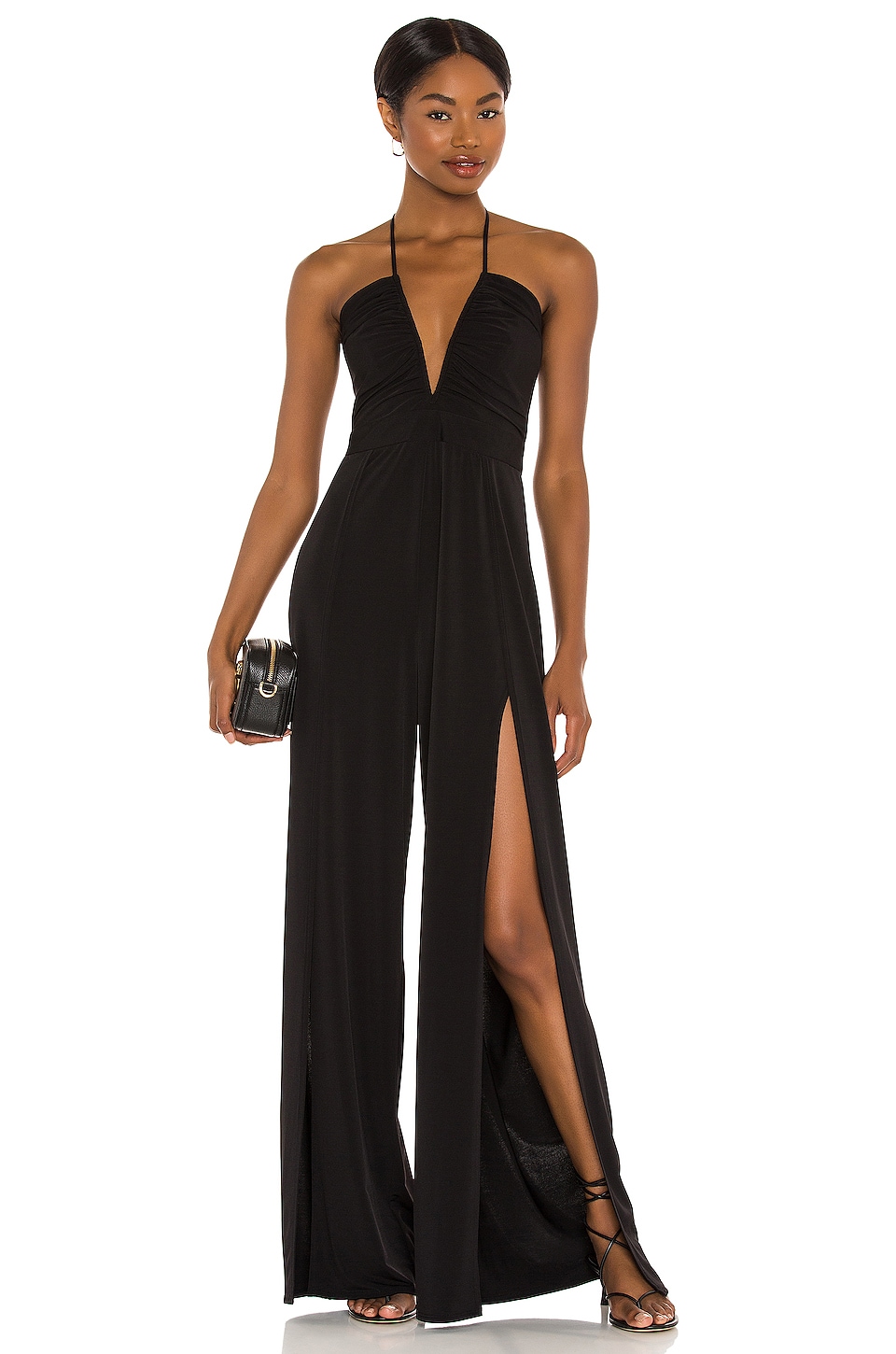 Sexy Black Designer Jumpsuit for Evening with Slits in Leg, Halter neck, low neck, and spandex