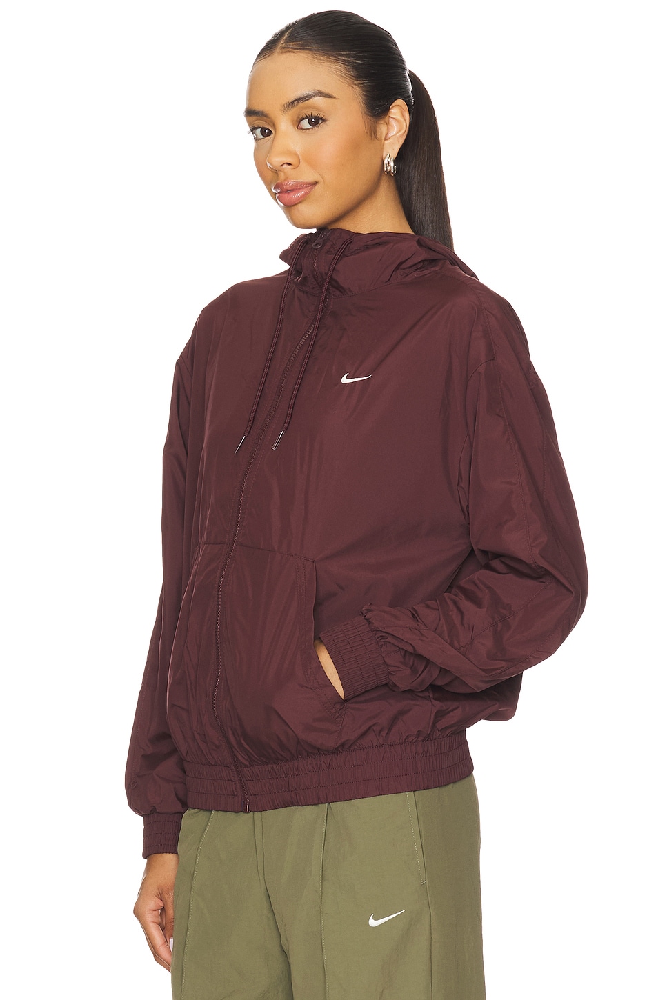 Nike Loose Essential Woven UV Hooded Jacket in Burgundy Crush & Sail | REVOLVE