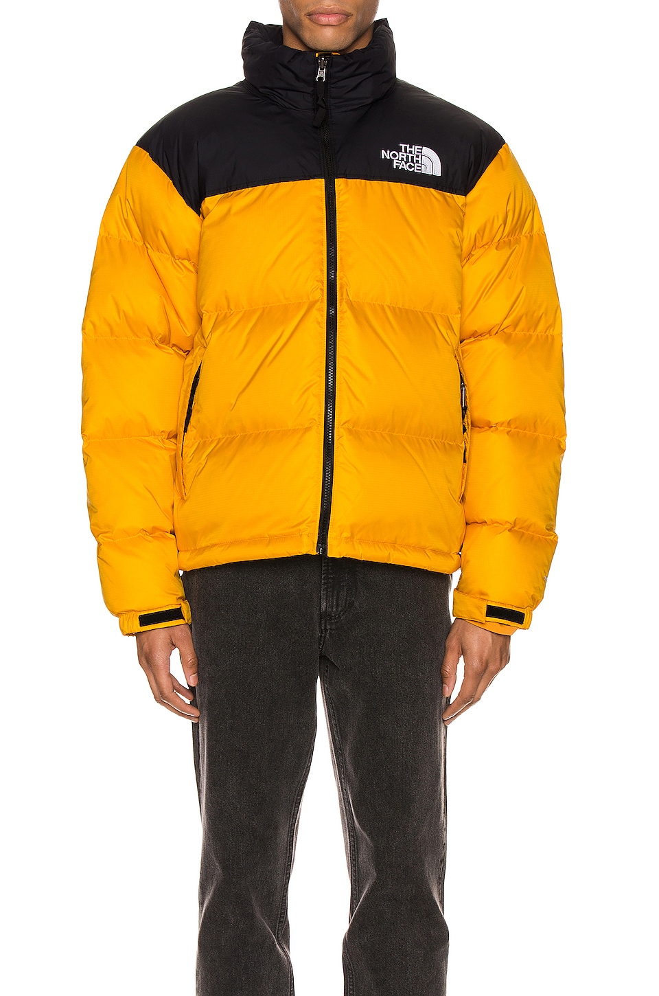 The North Face 1996 Nuptse Jacket in Summit Gold REVOLVE