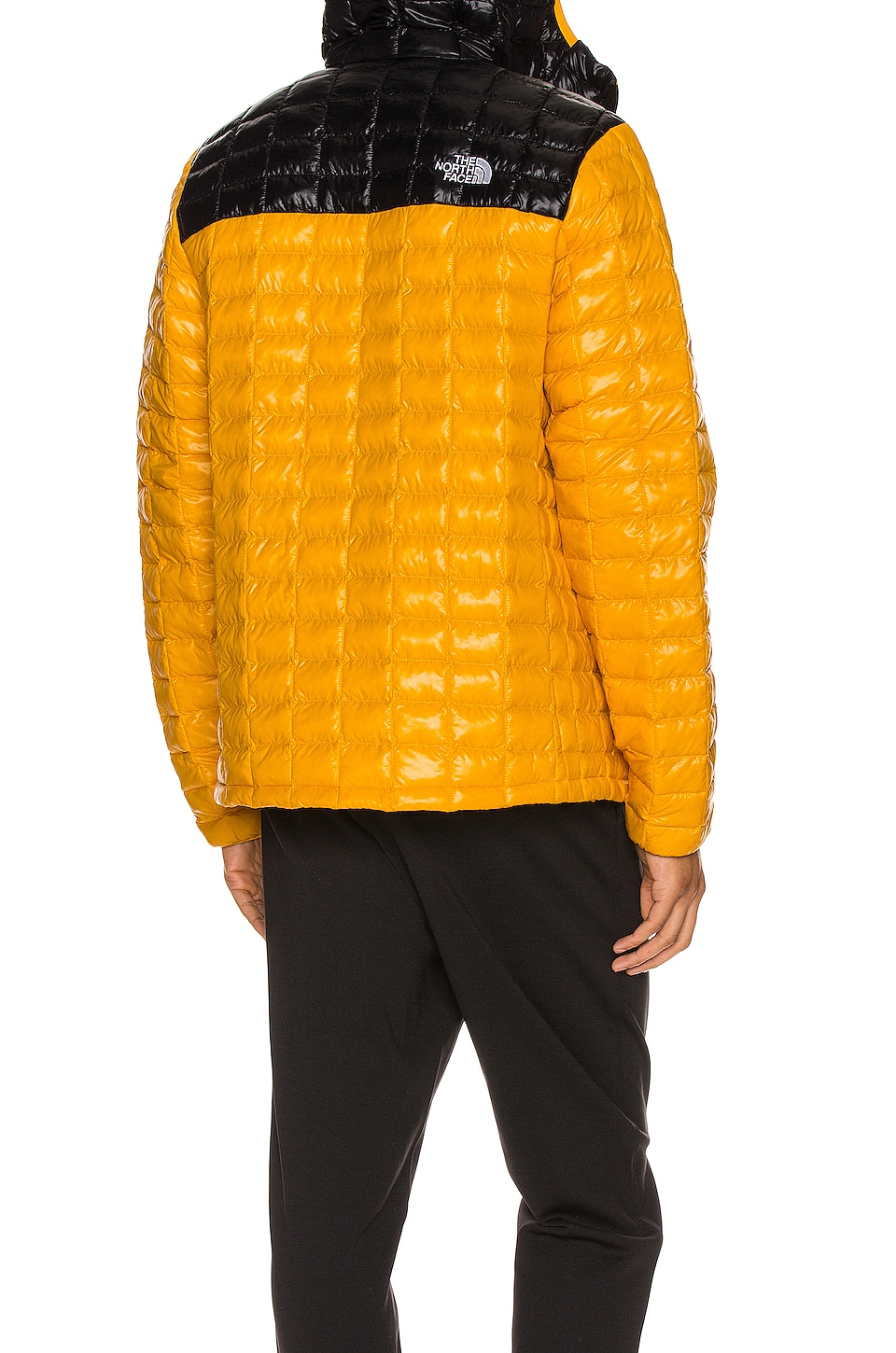 The North Face Thermoball Eco Hoodie in Summit Gold & TNF Black | REVOLVE