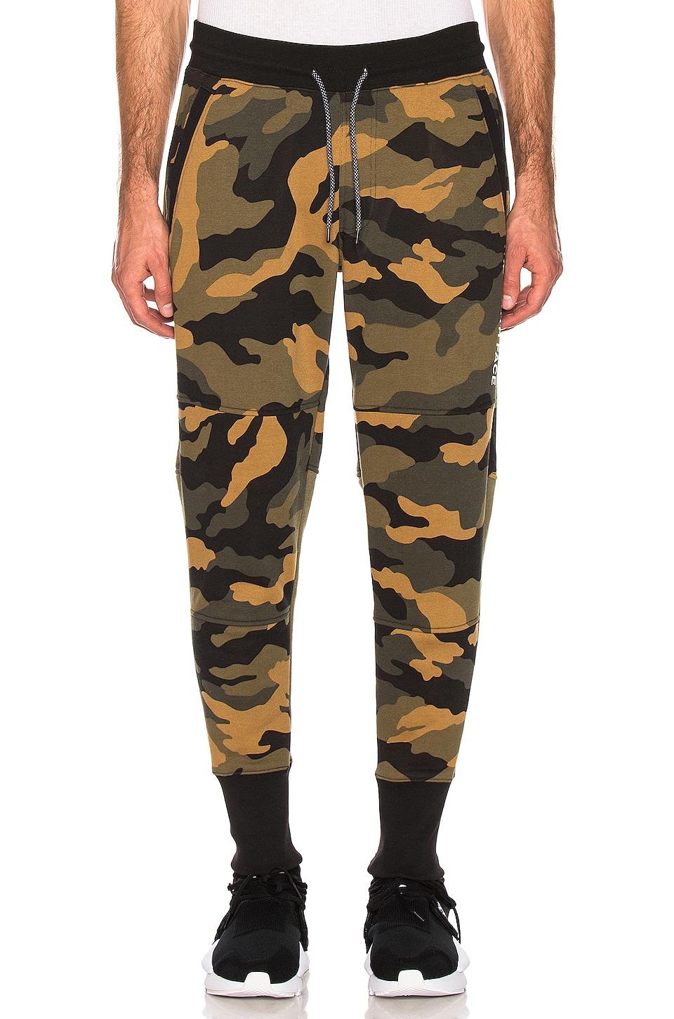 The North Face NSE Graphic Pant in Burnt Oliver Green Woods Camo Print ...