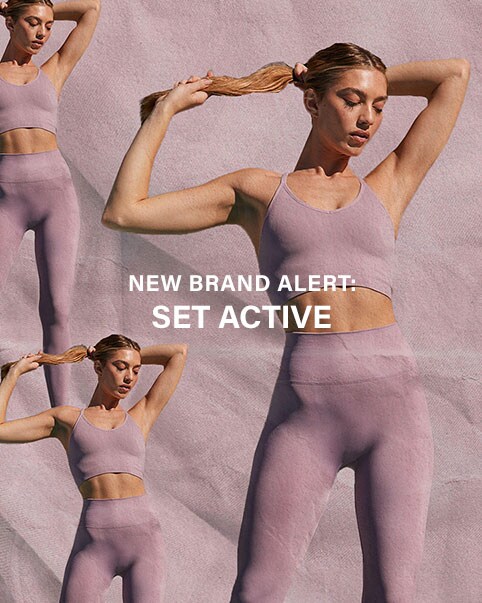 A model in a lunge position holding her hair up wearing a matching teal colored sports bra and legging activewear set. A model sitting outside wearing a baby blue sports bra, matching zip up hoodie, and matching leggings. A model standing holding her hair up wearing a lavender colored sports bra and matching leggings. NEW BRAND ALERT: Set Active. Shop Set Active.