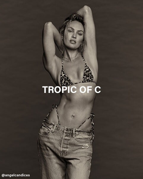 Candice Swanepoel sitting on pillows wearing a red bikini top with criss-cross straps and side tie bikini bottoms. A black and white photo of Candice Swanepoel wearing a leopard print bikini top, side tie bikini bottoms, and denim jeans. Candice Swanepoel standing in front of a palm tree background wearing a plum colored, space dye romper with a gold chain belt accent. Tropic of C. Shop the Collection.