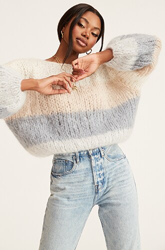 Model posing in a sweater.