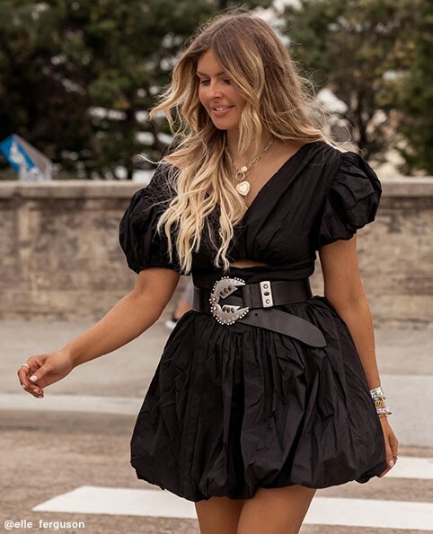 Elle Ferguson is standing in a crosswalk wearing a black mini dress with puff sleeves and a belted waist. What to Wear on the Weekend. Shop Now.
