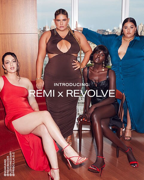 A photo of Mia Kang, Remi Bader, Amy Julliette Lefévre, and Priscilla Del Castillo. Mia is wearing a one-shoulder red maxi dress that features a high slit on one side. Remi is wearing a brown maxi dress that features thick straps, a v-neckline coming into a round cutout in the center of her chest and two cutouts on both sides of the dress. Amy is wearing a black leather mini dress that features a defined babydoll cup on the top with a tie in between and a slit on one side. Priscilla is wearing a blue long-sleeved maxi dress that features a collar, a deep v-neckline going into buttons the rest of the way down the dress. She has it unbuttoned towards the bottom for a middle slit-like effect. Introducing: REMI x REVOLVE. Shop the Collection.