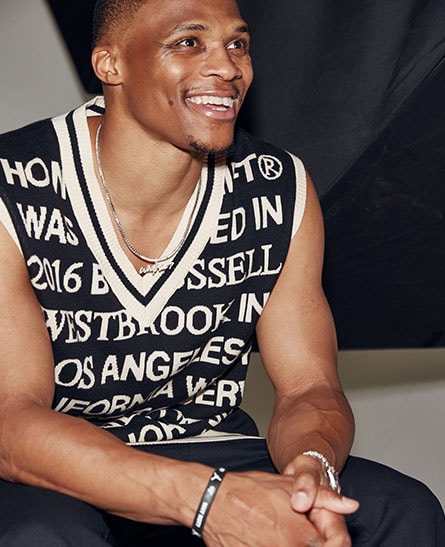 Russell Westbrook wearing a vest from his brand Honor The Gift