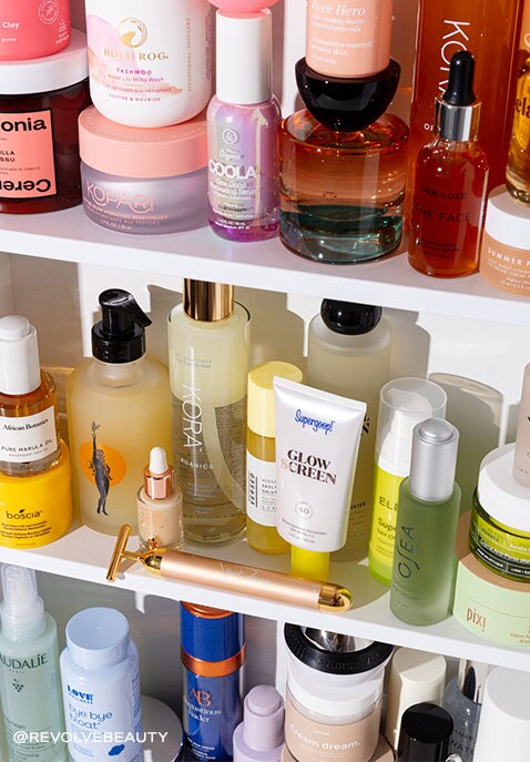  A colorful rainbow-like display of a variety of beauty product bottles lined-up tightly in a vanity