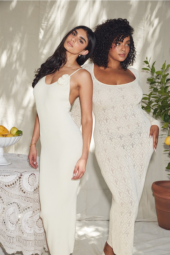 Woman in Ramya Pointelle Maxi Dress and Dara Rosette Midi Dress posing together