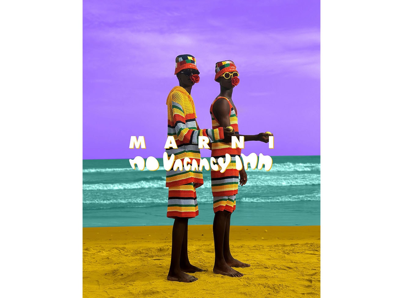 Two models on the beach wearing Marni X No Vacancy Inn.