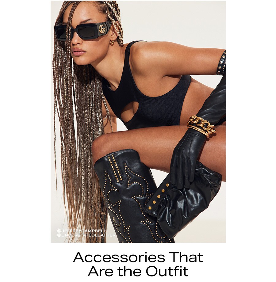 A black styled look complete with black and gold studded sunglasses, boots, gloves and jewelry accessories.