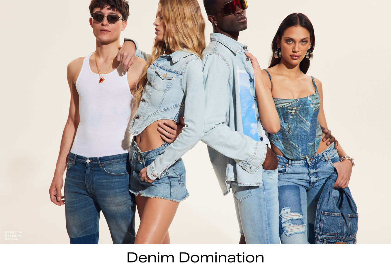 Four models dressed in full denim looks.