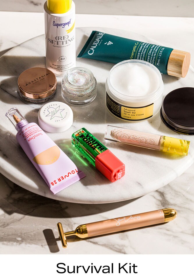 Variety of skincare products, makeup and tools.