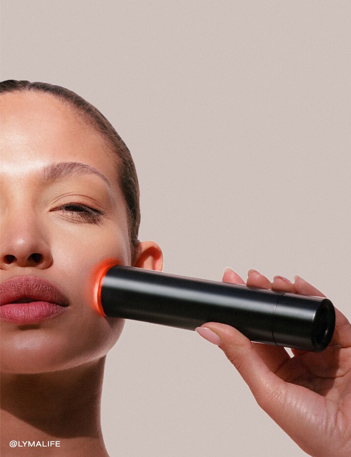 Model with LYMA Laser Skincare device.