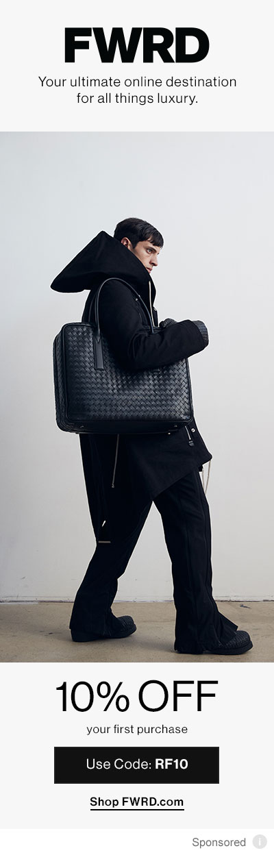 Man dressed in black holding bag