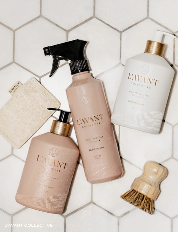 L'Avant Collective brand cleaning products on bath tiles.