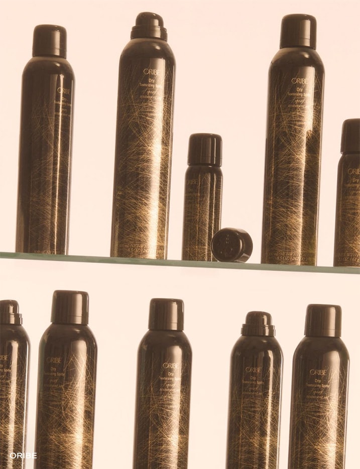 Multiple Oribe Brand Dry Shampoo bottles