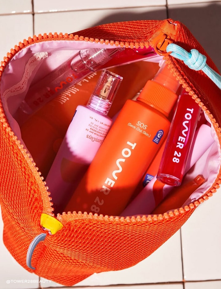 A pouch full of Tower 28 beauty products.