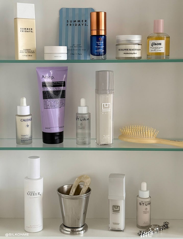 Glass shelf full of skincare.