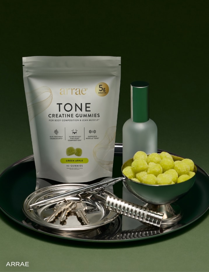 A pouch and a bowl of Arrae brand Tone creatine gummies.
