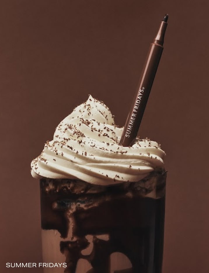 Summer Friday's lip liner dunked into a iced mocha drink with whipped cream.