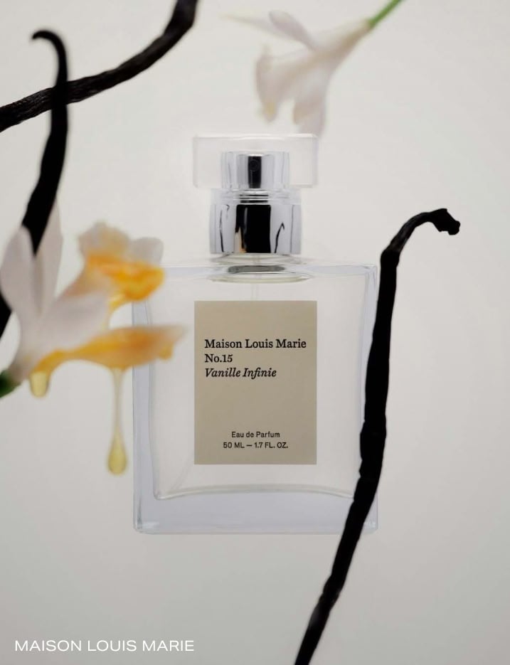 Maison Louis Marie perfume in Vanille Infine alongside vanilla beans.