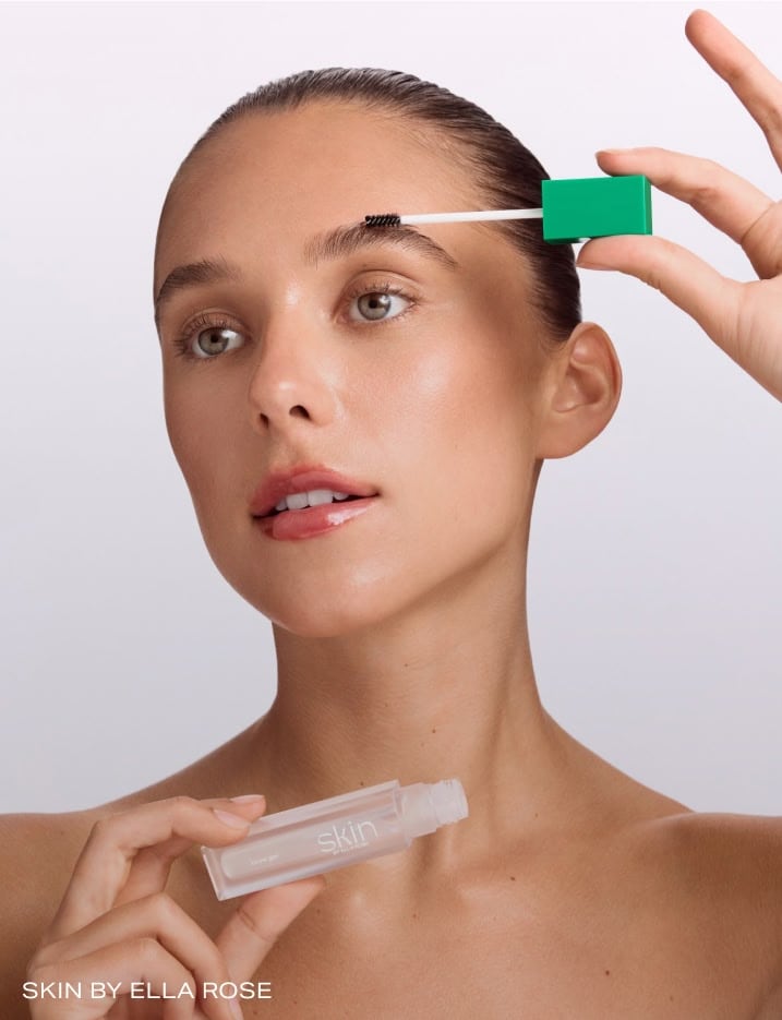Model applying eyebrow gel by Skin By Ella Rose.