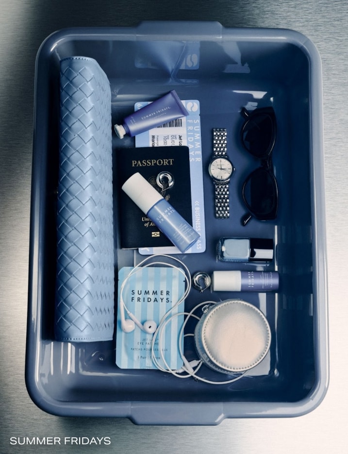 Variety of Summer Fridays products in a TSA bin.