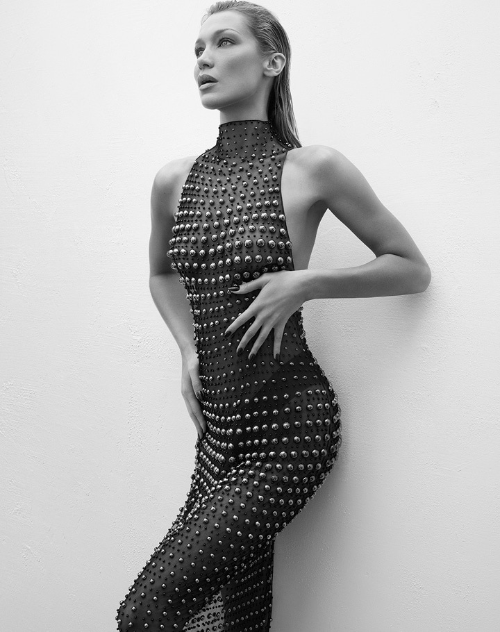 model bella hadid in black and white in a sheer black beaded maxi dress
