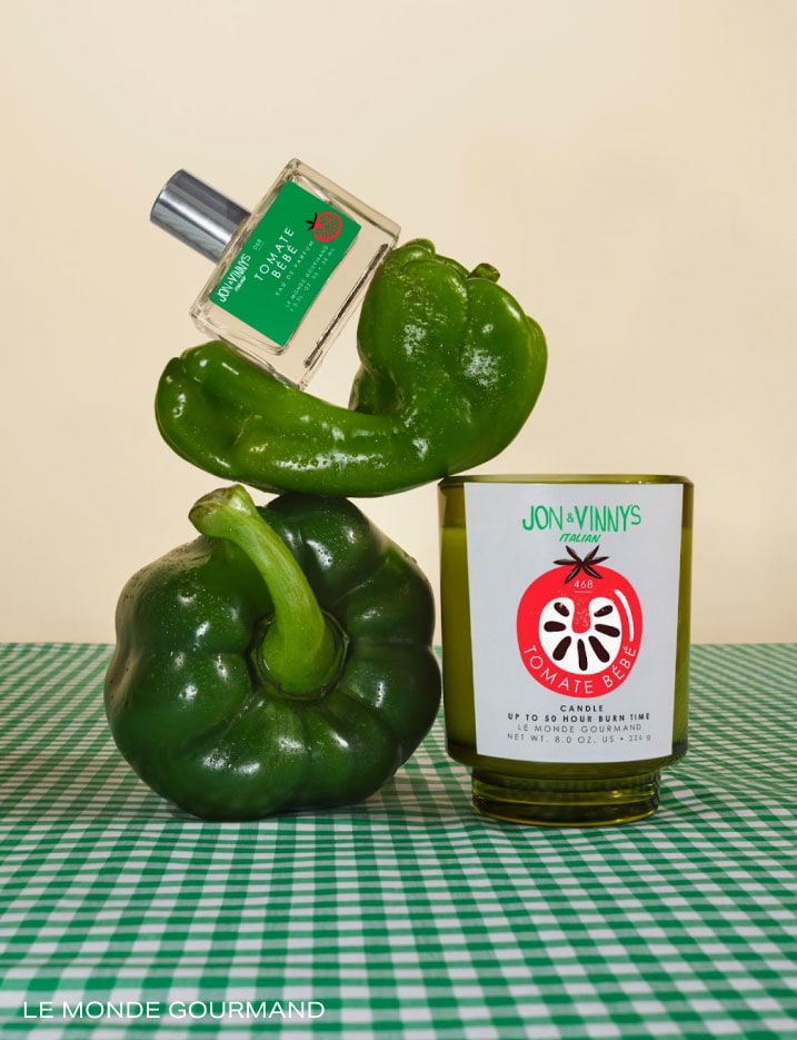 Green peppers and bottles of Jon & Vinny's Tomate Bebe fragrance and candle.